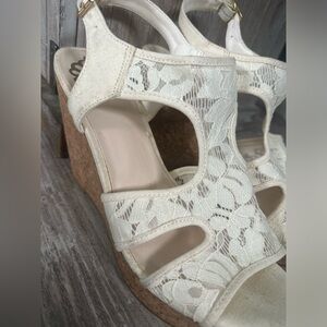 Creme lace wedge shoes .